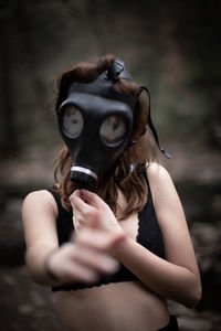 Woman wearing gas mask