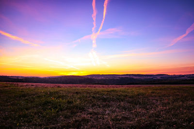 Scenic view of landscape against sky during sunset