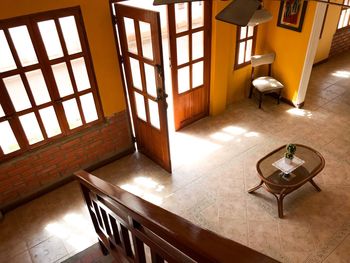 High angle view of empty chairs and table at home