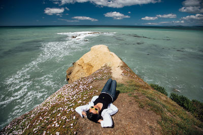 Carefree woman lying at beach