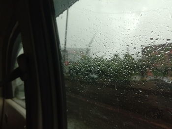 Close-up of wet window in rainy season