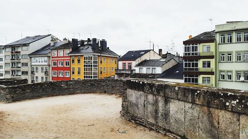 Buildings in city against sky