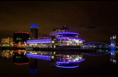 Reflection of illuminated buildings in water