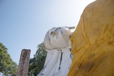 Low angle view of statue against sky