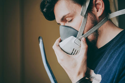 Portrait of young man using mobile phone