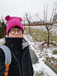 Portrait of person wearing hat during winter