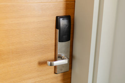 High angle view of telephone on door