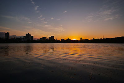 Scenic view of beach against sky during sunset