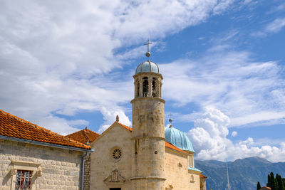 Historic building against cloudy sky