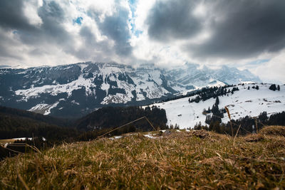 Scenic view of snowcapped mountains against sky