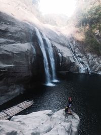 Scenic view of waterfall amidst rocks