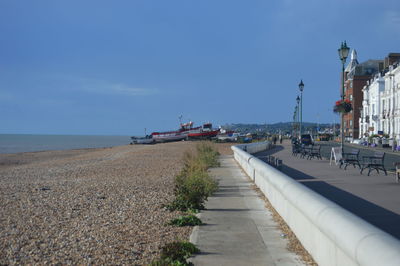 Road by sea against sky