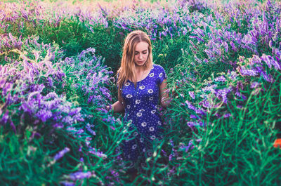 Portrait of woman with purple flowers