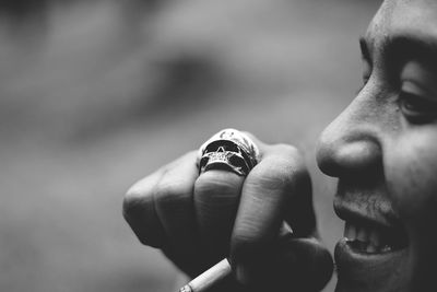 Cropped image of man smoking cigarette