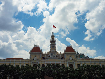 Low angle view of building against cloudy sky