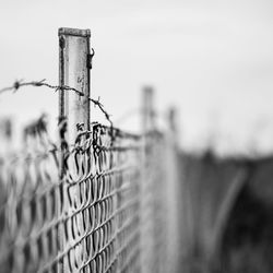 Close-up of barbed wire fence