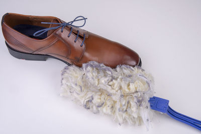 High angle view of shoes on floor against white background