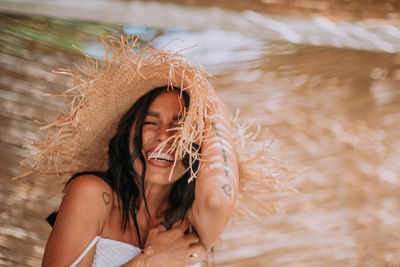 Portrait of beautiful young woman in water