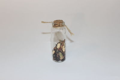 High angle view of crab in glass jar on white background