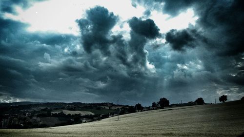 Scenic view of landscape against cloudy sky