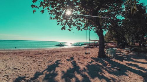 Scenic view of beach against clear sky