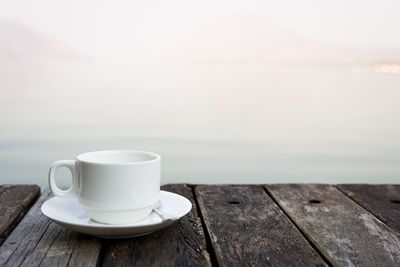 Close-up of coffee cup on table