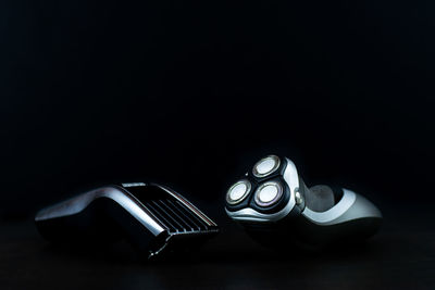 High angle view of camera on table against black background