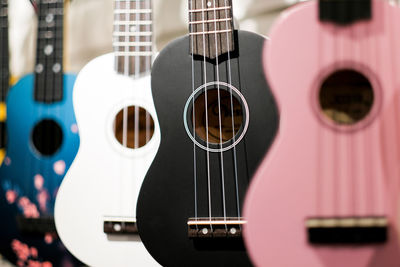 Multicolored acoustic guitars close up.