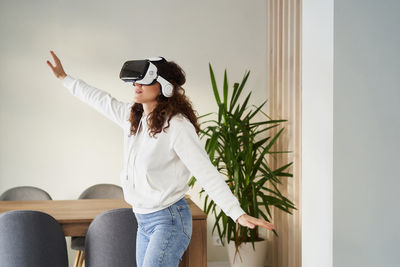 Woman sitting on sofa at home