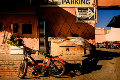 Rear view of man riding bicycles on street