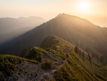 Scenic view of mountains against sky during sunset