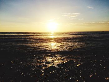 Scenic view of sea at sunset