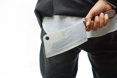 Midsection of man working on white background