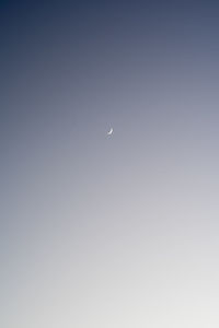 Scenic view of moon against clear sky at night