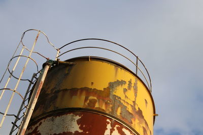 Low angle view of metal structure against sky