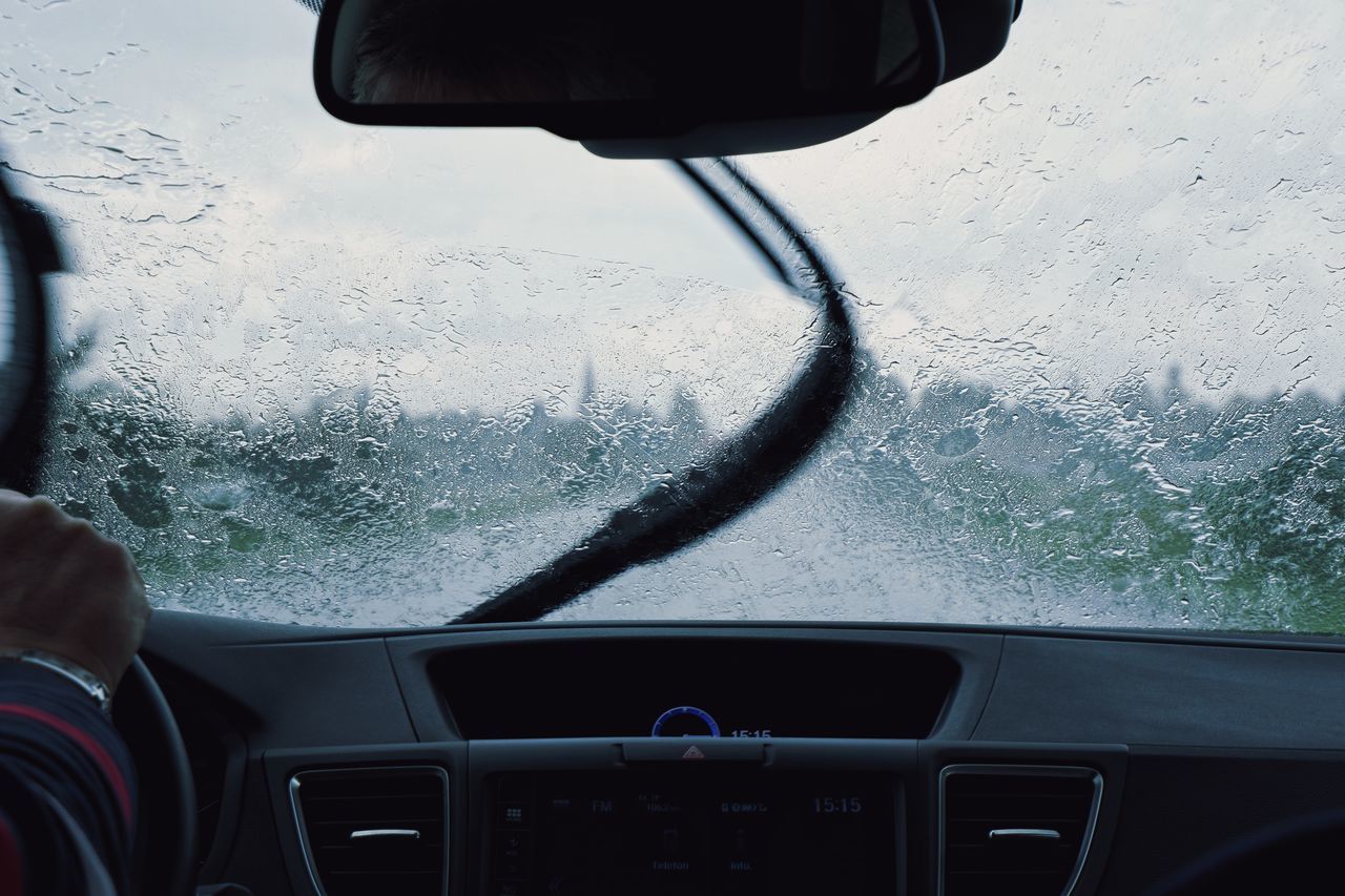 WET CAR SEEN THROUGH WINDSHIELD