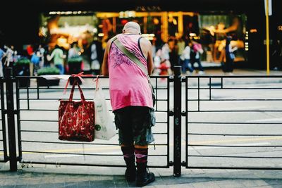 Rear view of woman standing at night