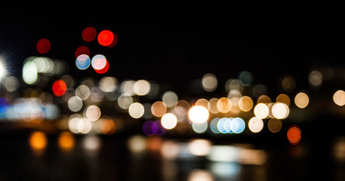 Defocused lights/bokeh at night looking across london buildings from tate modern, london