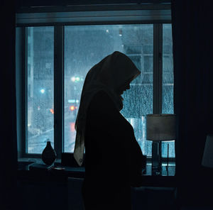 Prego mom waiting for the baby behind the city lights