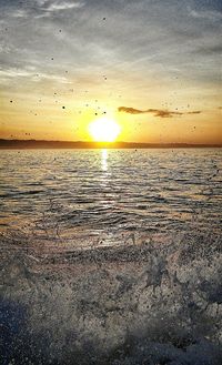 Scenic view of sea at sunset