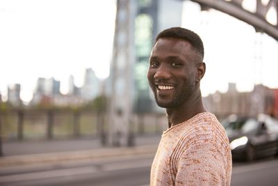 Portrait of young man standing outdoors