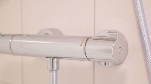Close-up of faucet in bathroom