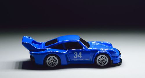 Close-up of toy car against blue background