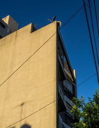 Low angle view of building against clear blue sky