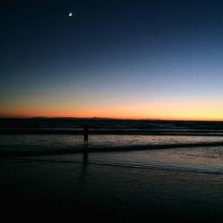 Scenic view of sea at sunset