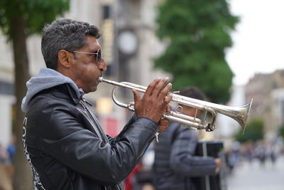 Side view of man playing outdoors