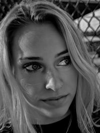 Close-up portrait of smiling young woman