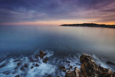 Scenic view of sea at sunset