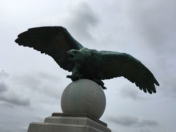 Low angle view of statue against sky