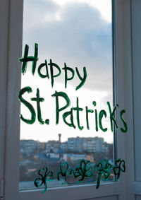 Close-up of text on glass window